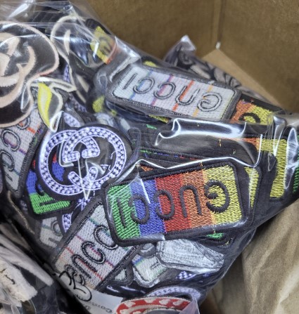 Arlington Police Detectives Seize More Than $650,000 in Counterfeit Merchandise, Suspect Arrested